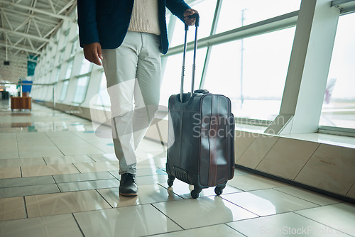 Image of Airport legs, travel and man walking to airplane, flight booking or transportation for corporate trip. Luggage suitcase, plane departure or African businessman on holiday, vacation or global journey