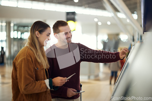 Image of Couple in airport typing on self service screen for digital passport identity or flight data to travel on airplane. Smart check, woman or happy man pressing code for on futuristic technology at kiosk