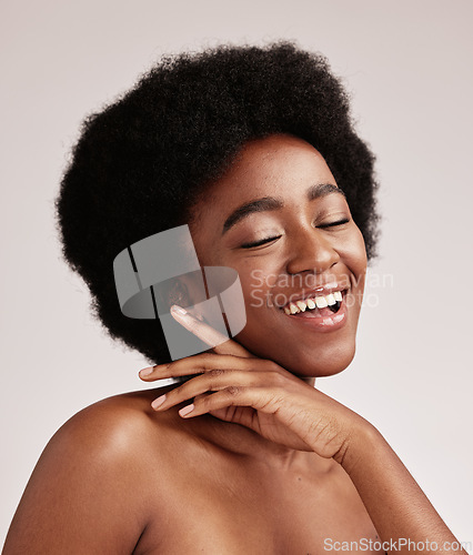 Image of Beauty, happy black woman and skin glow of a young person face with hands after facial. Wellness, cosmetics and model in a isolated studio with a smile doing dermatology, detox and spa self care