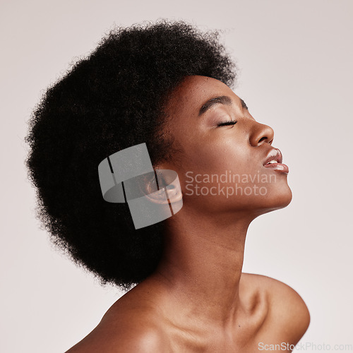 Image of Beauty, black woman profile and skincare aesthetic with skin glow and cosmetics in a studio. Dermatology, facial and self care of a young person model feeling calm from cosmetic and detox treatment