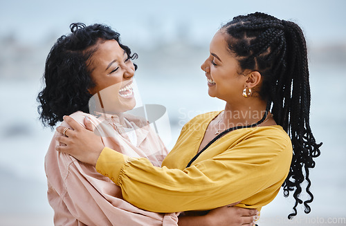 Image of Travel, friends and happy black women on beach embrace while on fun ocean holiday in Cancun. Smile, friendship and vacation at the sea, woman and friend or partner laughing at funny joke and hugging.