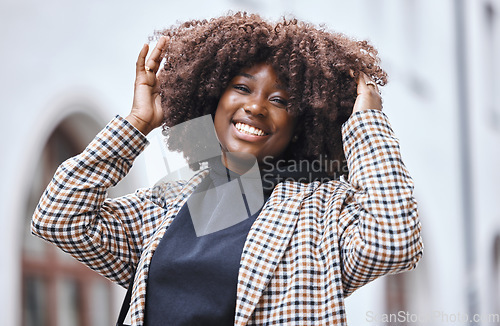 Image of Black woman, portrait and afro hair in city fun, goofy or silly travel in urban New York or holiday location. Smile, happy or playful student in fashion, trendy or cool clothes with natural hairstyle