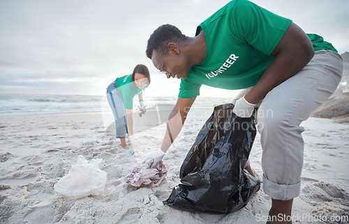 Image of Friends, cleaning and recycling with people on beach for sustainability, environment and eco friendly. Climate change, earth day and nature with volunteer for community service, pollution and plastic