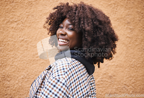 Image of Black woman, portrait and laughing on wall background in city, urban town or fun in Kenya. Happy young african female smile for happiness, face and curly afro hair with fashion, motivation or freedom