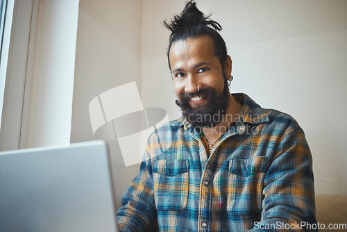 Image of Man, laptop and portrait for remote work, cafe wifi and creative style while working online. Entrepreneur person at table for social media, networking and planning while writing blog, email or report