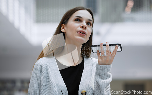 Image of Phone call, voice assistant or student woman in library for education, communication or loud speaker. University memo or girl on smartphone for scholarship discussion, talking or virtual assistance