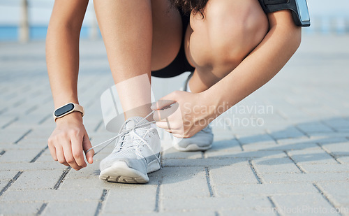 Image of Shoe lace, fitness and woman outdoor, exercise and training for competition, health and wellness. Ready, female athlete and runner with sneakers, tying laces or workout for practice, energy or cardio