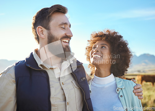 Image of Love, cow and smile with interracial couple on farm for agriculture, partnership and agro. Teamwork, animals and hug with man and black woman in grass field for sustainability, cattle and environment