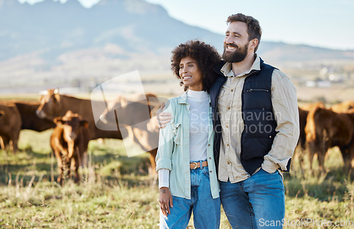 Image of Happy, cow and relax with interracial couple on farm for agriculture, nature and growth. Teamwork, animals and hug with man and black woman in grass field for sustainability, cattle and environment