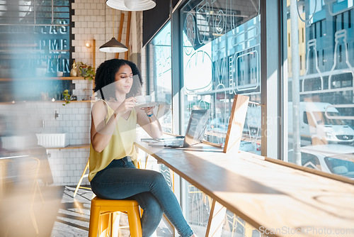 Image of Coffee, tea and woman working in a cafe or Restaurant with laptop drinking espresso and planning. Freelancer, job and online or remote work for young female relax or break in the morning