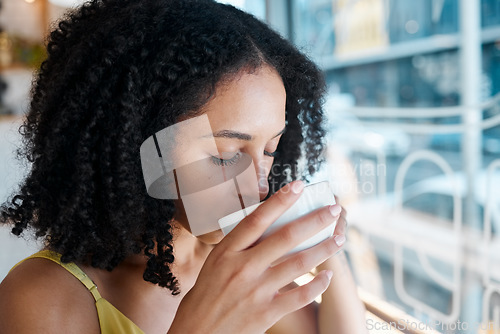 Image of Black woman, relax or drinking coffee in cafe or restaurant for lunch break, mindfulness or self love zen. Beverage, student or person with tea cup drink for personal time, inspiration or calm peace