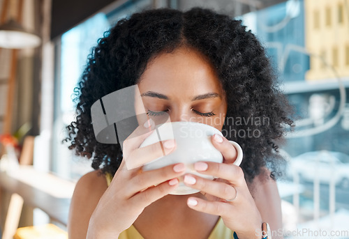 Image of Person, relax or drinking coffee in cafe or restaurant for lunch break, mindfulness or self love zen. Beverage, student or black woman with tea cup drink for personal time, inspiration or calm peace