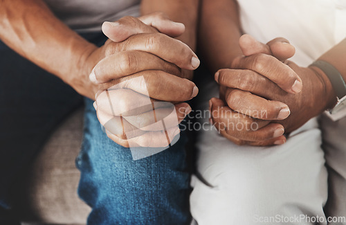 Image of Senior, hands and couple sitting together for support, relax and bonding in retirement. Hope, insurance and fingers of an elderly man and woman on a couch for marriage, respect and compassion