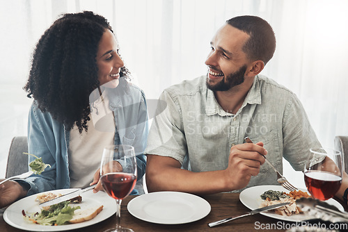 Image of Happy young couple eating lunch with wine for celebration of love, holiday or valentines with conversation. Mexico people or woman and partner with food at home dining room table on a date together