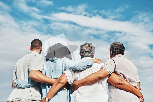 Image of Family, back and hug with blue sky and grandparents and man together outdoor. Love, care and senior people looking at view in nature feeling happiness and joy from travel for holiday in summer