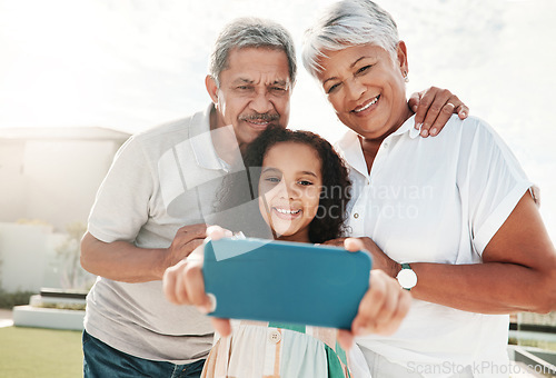 Image of Grandparents, child and bonding selfie in garden, nature park or backyard in family support, social media or profile picture. Smile, happy and kid and retirement elderly, man or woman in photography