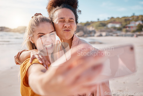 Image of Selfie, women and friends on beach, funny and summer vacation for break, bonding and playful together. Love, females or crazy ladies on seaside holiday, smartphone for pictures or memories of getaway