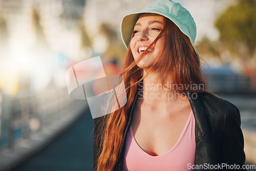 Image of Travel, happy and mockup with a woman in the city, walking outdoor as a tourist on a summer day. Thinking, freedom and flare with an attractive young female traveler taking a walk for tourism