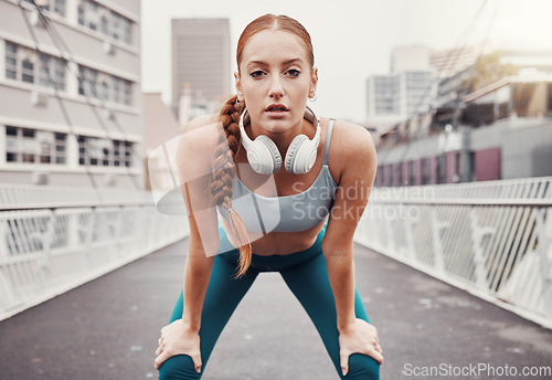 Image of Sports, exercise and portrait of woman in city with motivation, determination and focus for health goals. Running, fitness and face of girl in urban town for workout, wellness and marathon training