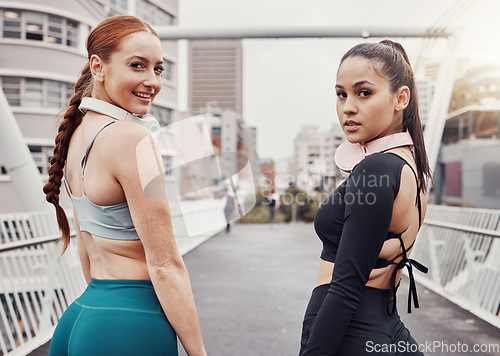 Image of Portrait, fitness or friends on a bridge for training, cardio workout or exercise together in an urban city. Girl runners, partnership or healthy sports women ready to start running for body goals