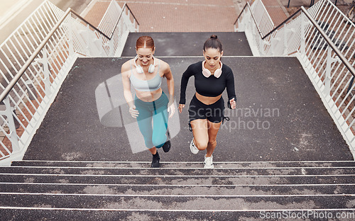 Image of Fitness, sports or friends running on steps exercise together for healthy lifestyle, wellness or exercising for marathon. Athletes, runners or fast women training in cardio workout on stairs in city