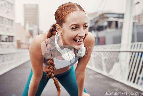 Image of Fitness, sports and face of woman laugh in city with motivation, happiness and smile for health achievement. Running, exercise and happy girl in urban town for workout, wellness and marathon training