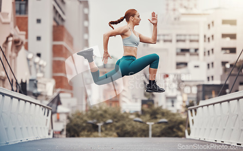 Image of Workout, jump and health with woman in city for training, cardio and endurance. Energy, fitness and exercise with girl athlete and warm up in urban town for sports, running and body wellness