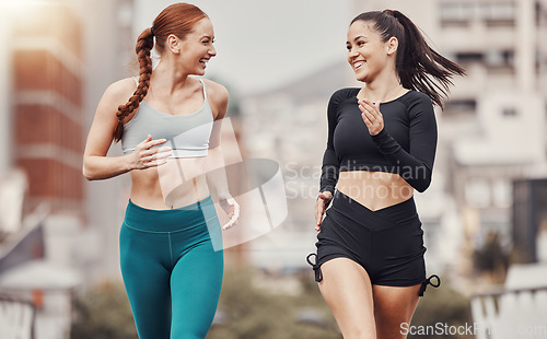 Image of Runner women, friends and smile together in city for workout, wellness and strong body for teamwork in morning. Woman training group, running and exercise team in metro for support, chat and happy