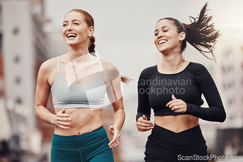 Image of City fitness, friends and happy running for wellness, energy and outdoor exercise. Sports, healthy women and runner athletes training for cardio workout in urban street with freedom, power and smile