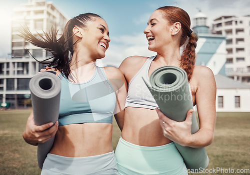 Image of Yoga, fitness and laughing with woman friends in the park together for mental health exercise. Pilates, funny and training with a female yogi and friend outside on a grass field for a summer workout