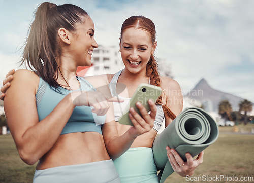 Image of Yoga, fitness and social media with woman friends in the park together for mental health exercise. Exercise, phone and training with a female and friend outside on a grass field for a summer workout