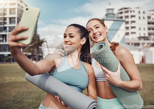 Image of Yoga, fitness and selfie with woman friends in the park together for mental health exercise. Pilates, social media and training with a female and friend outside on a grass field for a summer workout