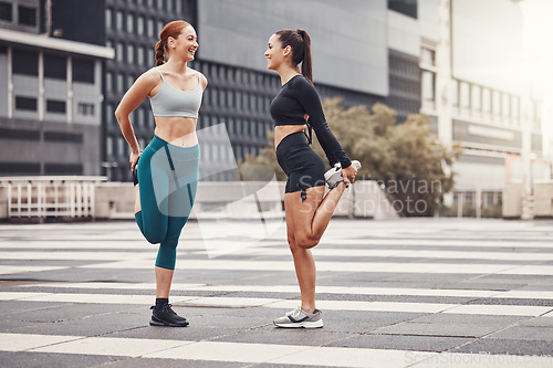 Image of Fitness, woman and friends stretching in the city for running, cardio exercise or workout. Active women in warm up stretch together in preparation for exercising, run or sports workout in urban town