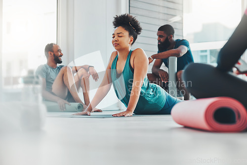 Image of Black woman, yoga and meditation class with exercise for fitness, peace and wellness. Group of people in gym studio for holistic workout, mental health and body balance with zen mind and energy