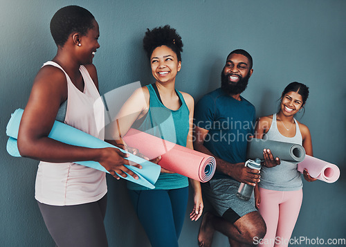 Image of Yoga, talking friends and wall of pilates class in a gym with a exercise and training break. Conversation, wellness and communication of black people together ready for zen, balance and relax