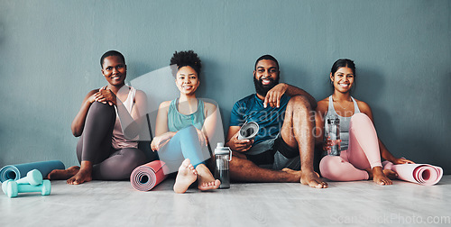 Image of Yoga, fitness portrait and black people happy at pilates class in gym with a exercise and training break. Lounge, wellness and peace of friends on floor ready for zen, balance and relax by wall