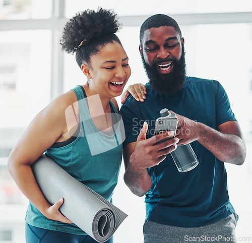 Image of Phone, meme or yoga friends on social media laughing at funny online content after a fitness class. Pilates, black woman and happy African personal trainer relaxing or enjoying crazy comedy together