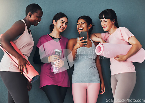 Image of Fitness friends, smartphone and funny meme on social media, communication and workout group, women at yoga together. Exercise mat, mobile app and connection with comedy online, laugh and health