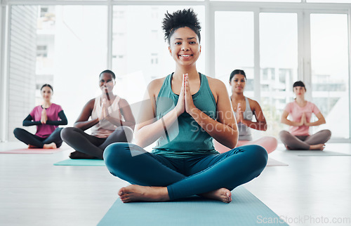 Image of Black woman, yoga portrait and meditation with zen exercise for fitness, peace and wellness. Instructor and diversity group in gym class for prayer hands holistic workout, mental health and body