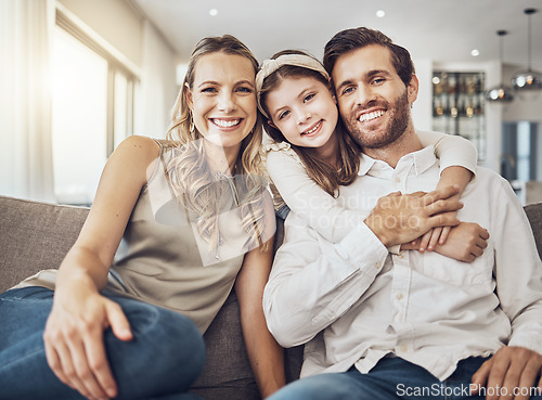 Image of Portrait, mother or father hugging a girl to relax as a happy family in living room bonding in Australia with love or care. Trust, embrace or parents smile with kid enjoying quality time on a holiday