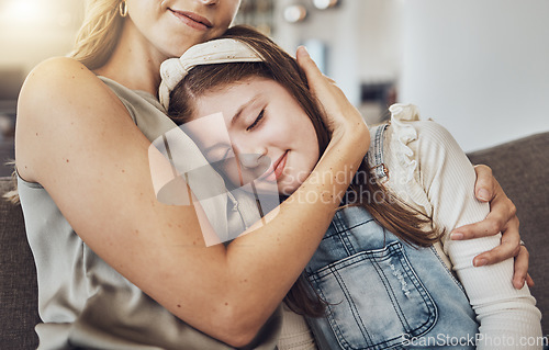 Image of Love, hug or mother with a girl to relax as a family in living room bonding in Australia for childcare. Hugging, smile or mom with a happy calm kid enjoying quality time on a peaceful holiday at home