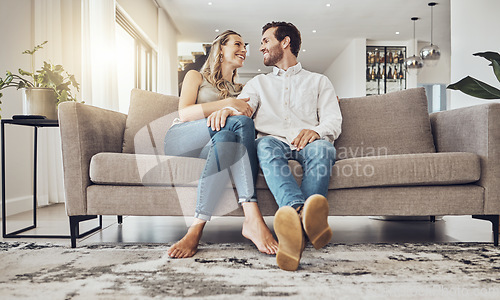 Image of Love, comfy and couple on the sofa to relax with a smile and gratitude in living room. Happiness, laughing and happy man and woman comfortable on the couch for peace, conversation and affection