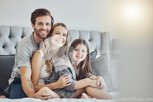 Image of Portrait, mother or father hugging a girl to relax as a happy family in bedroom bonding in Australia with love or care. Morning, embracing or parents smile with kid enjoying quality time on holiday