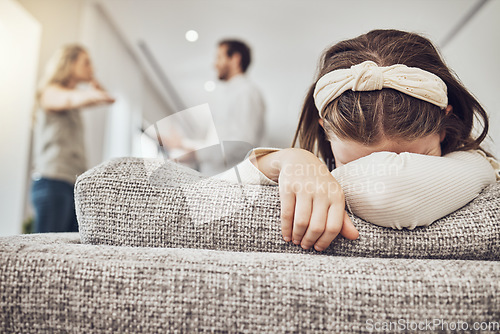 Image of Sad little girl, sofa and parents in fight, conflict or disagreement in the living room at home. Family, divorce and husband in argument with wife and crying child on lounge couch in depression