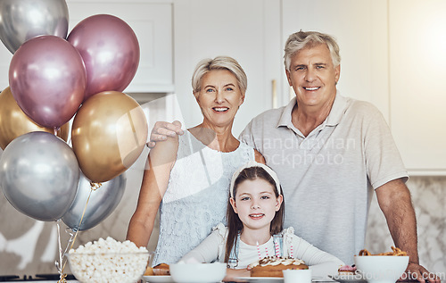 Image of Portrait, grandparents or girl in celebration of a happy birthday in house party or kitchen with popcorn or cake. Grandmother, old man or child bonding with love or care in family home to celebrate