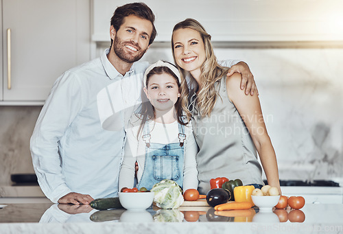 Image of Portrait, parents or girl cooking vegetables as as happy family in a house kitchen with organic food for dinner. Development, father or mom teaching, helping or bonding with a healthy child at home
