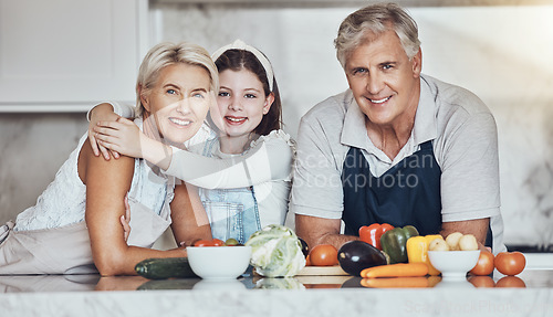 Image of Portrait, grandparents or girl cooking as a happy family in a house kitchen with organic vegetables for dinner. Grandmother, old man and young child bonding or helping with healthy vegan food diet