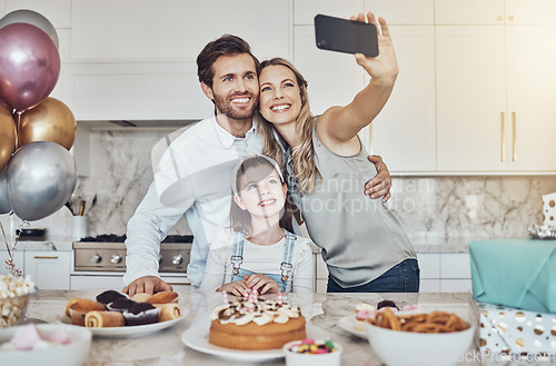 Image of Selfie, parents or girl in celebration of a happy birthday in house party or kitchen with popcorn or cake. Mother, father or child bonding with love or care in family home take pictures to celebrate