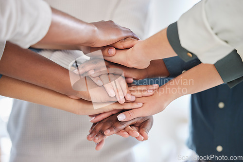 Image of Teamwork, diversity and team stack of hands for celebration, motivation or partnership in office. Multiracial, collaboration and business people celebrating together for success, achievement or goal.