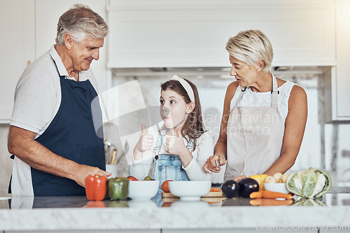 Image of Thumbs up, grandparents or child cooking in kitchen as a happy family in a house with healthy vegetables at dinner. Grandmother, old man or girl with a yes, like or good hand sign helping with diet